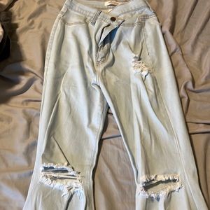 light wash bell bottom ripped jeans